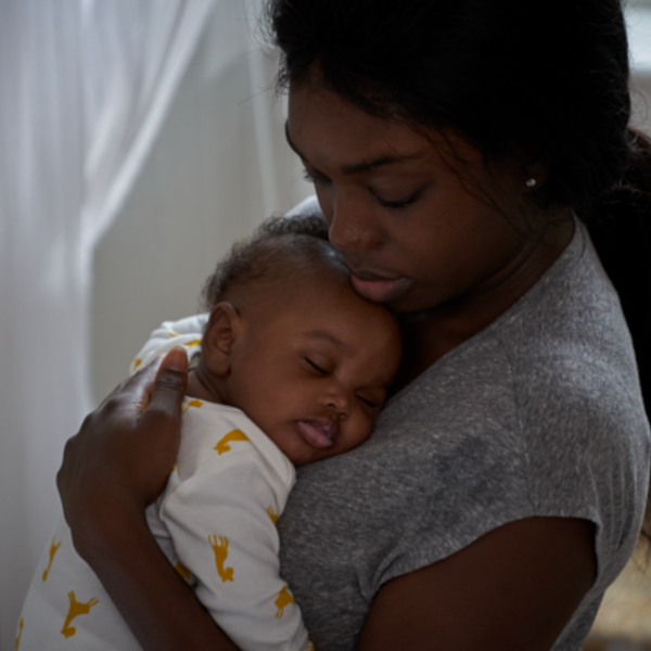 Photo of baby being held by mum