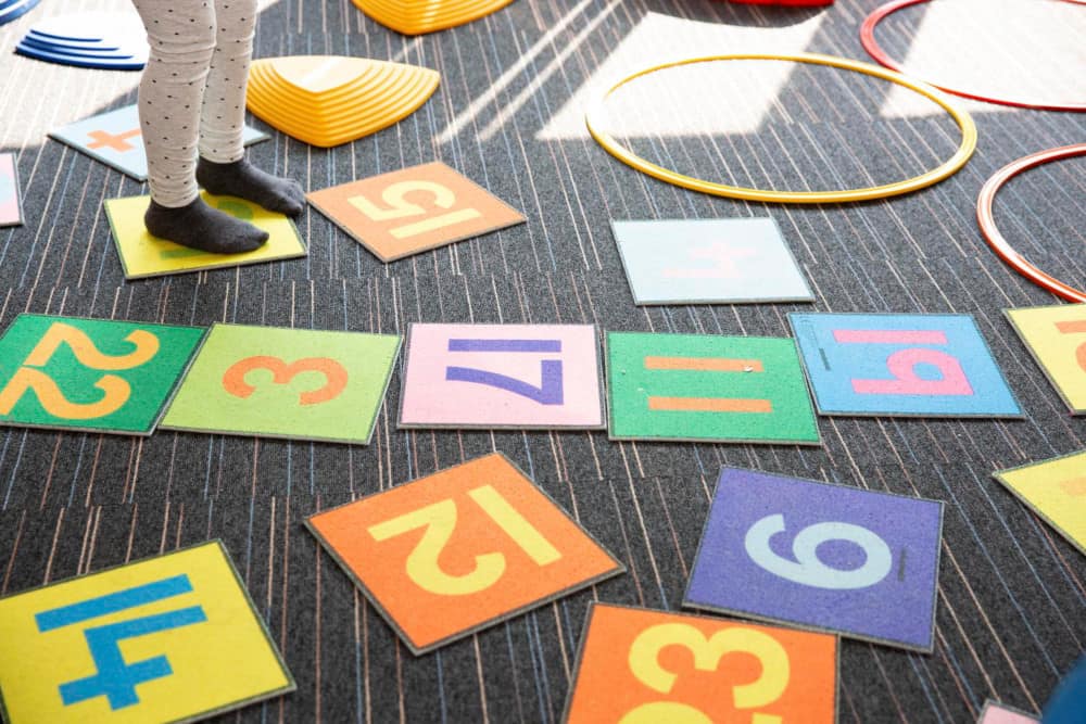 Image of play tiles with numbers written on them.