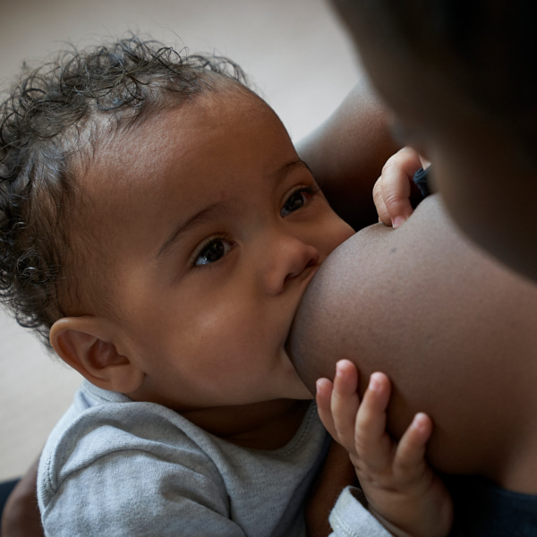 Photo of a baby being breastfed. 