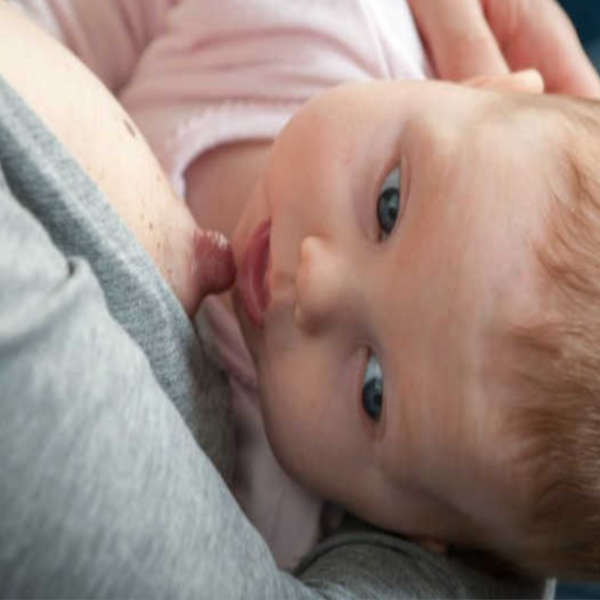 Photo of a baby breastfeeding