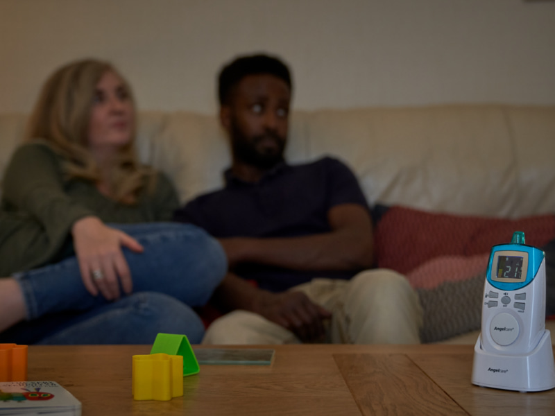 Photo of parents sitting on couch 