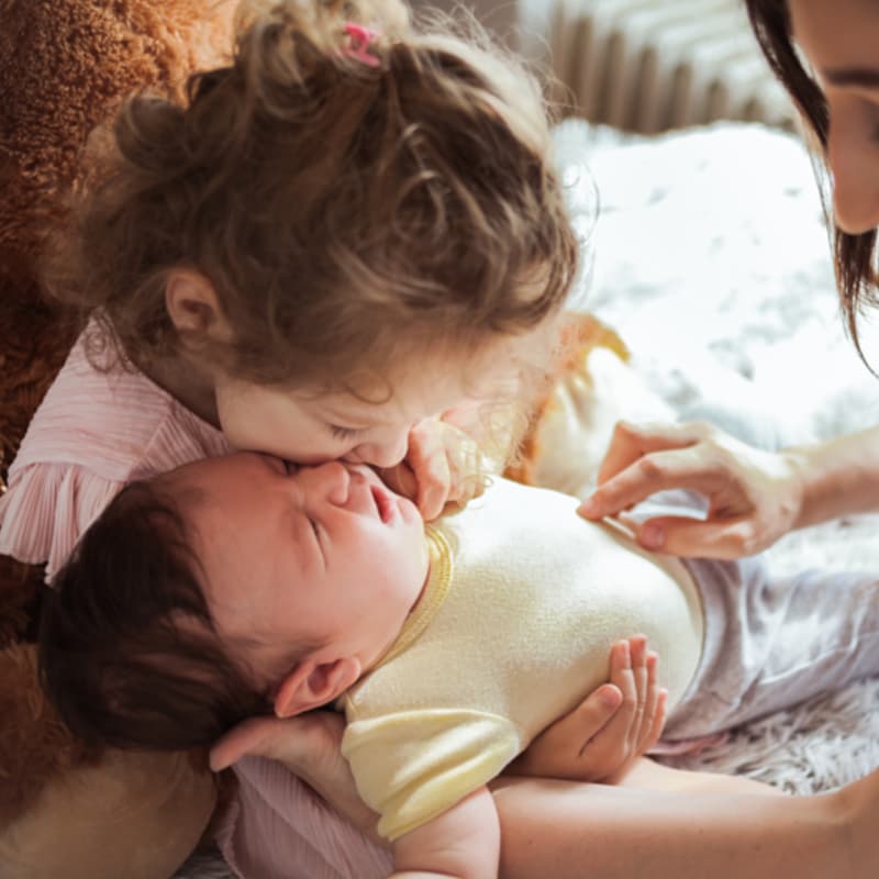 Photo of toddler and baby