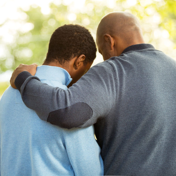 A father and son in an embrace