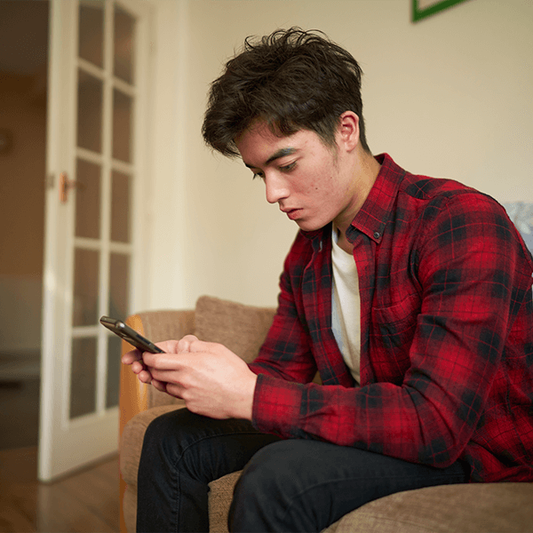 teen-boy-on-mobile-texting-button