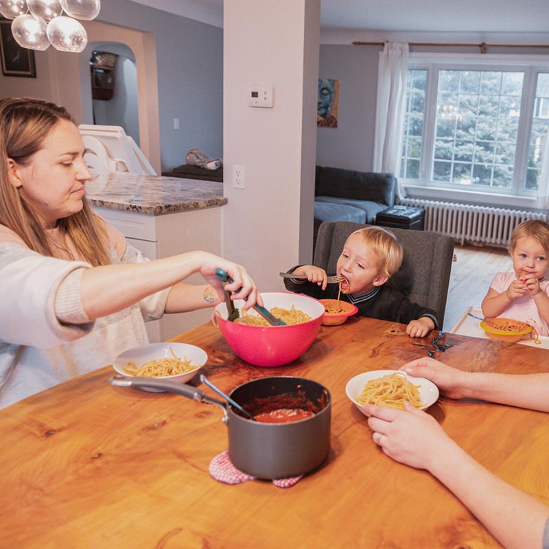 Family with toddlers eating together