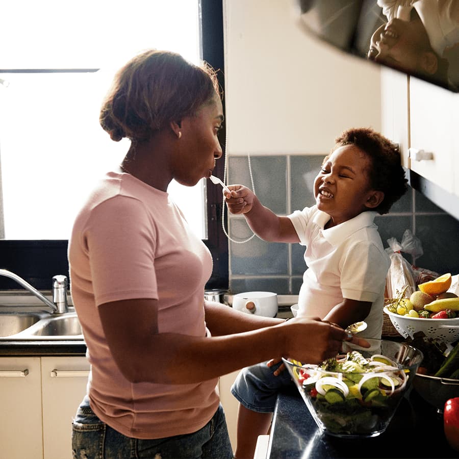 Mother and son in the kitchen with food
